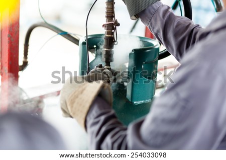 Man work a propane tank