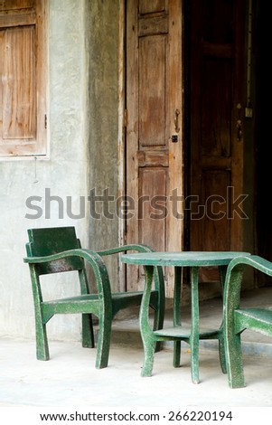 Living area, wood green chair and wood door