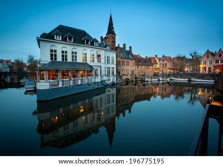 Bruges is known for its canals therefore called Venice of North.  Restaurants by the canal.