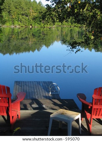 adirondack chairs facing the lake