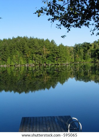 early morning lake view on a bright and clear day with calm lake water