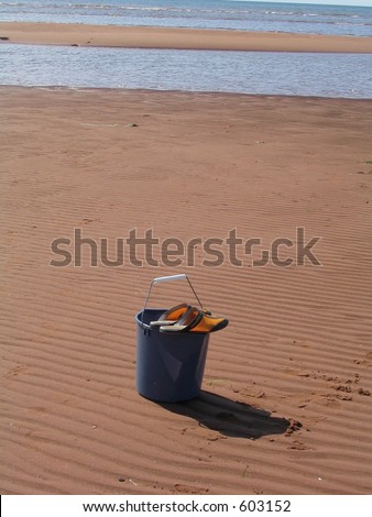pail shoes sand and shore