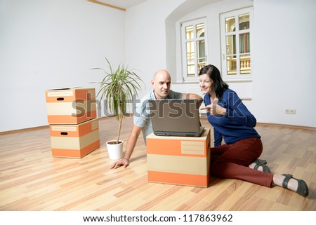 young couple moves the house