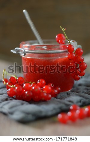 a glass of self-made red currant jam
