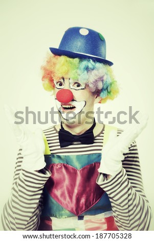 studio shot of a happy clown