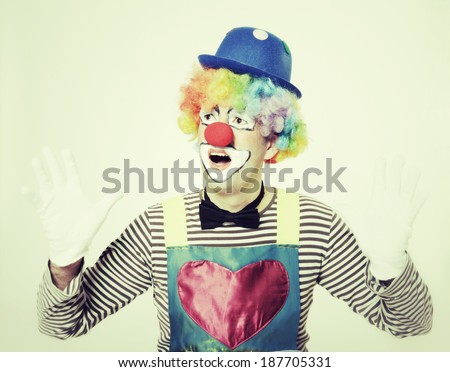 studio shot of a happy clown