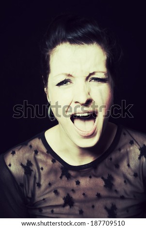 dark portrait of a screaming and crying woman