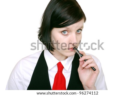 woman searches for an idea while biting on a pen
