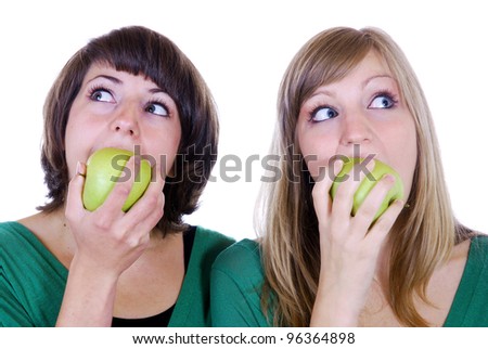 two young women with apples