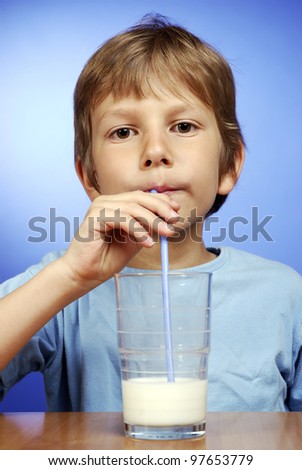 happy boy with glass of milk