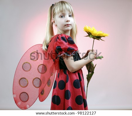 little girl in lady bug costume