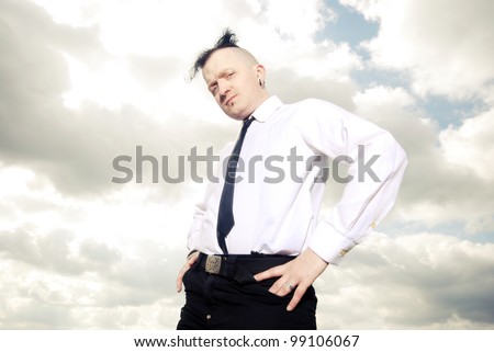 portrait of a strange man in business clothing against cloudy sky