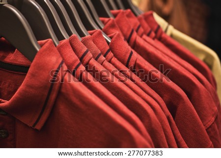Red shirts on a rack