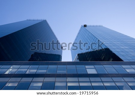 Two skyscrapers and blue sky