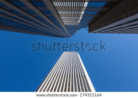 Horizontal skyscraper reflection over Chicago blue sky