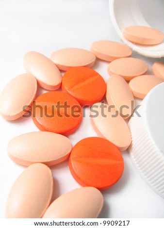 Closeup of pills spilt from bottle