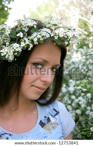 Beautiful girl with white flower diadem