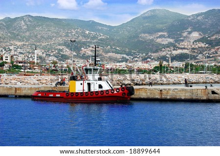 harbor in turkey with red ship