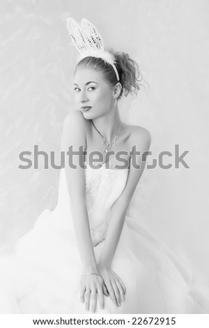 elegant woman in dress and bunny ears blue toned