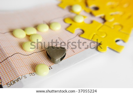 ECG diagram and pills with symbolic heart