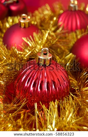 Red balls and golden decoration as Christmas background