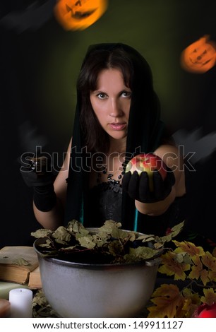 Witch giving poisoned apple at Halloween night