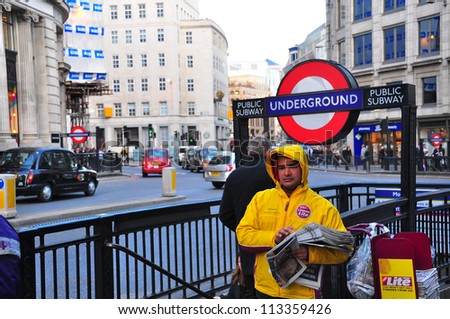 LONDON - APRIL 7: An unidentified man gives out \