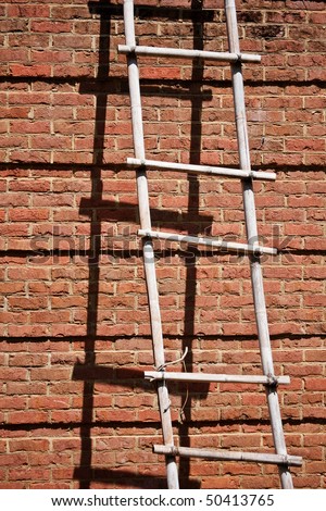 Brick Wall With Old Ladder And Shadows