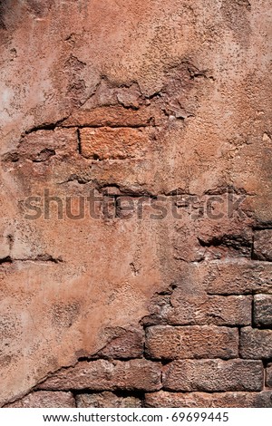 Grunge wall made of brick and mortar