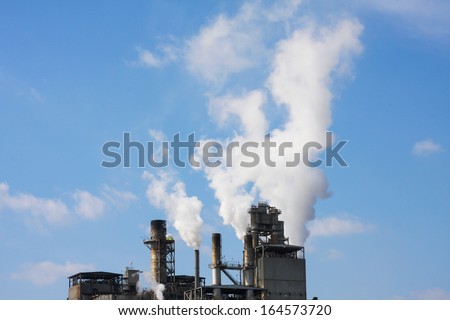 Factory with smoke coming out of smokestacks