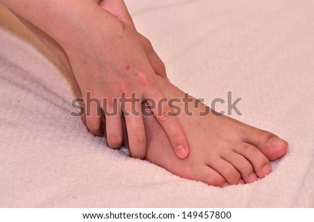 Woman massage her sore foot