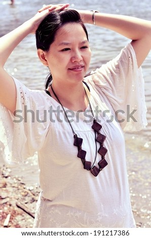Vintage style Asian young woman outdoor portrait  with a soft instagram like filter