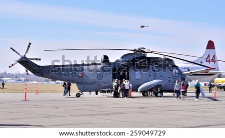 ABBOTSFORD, CANADA - MARCH 08: Aerobatic helicopter displays for civilian at the International Aerospace event on March 08, 2015 in Abbotsford, Canada.