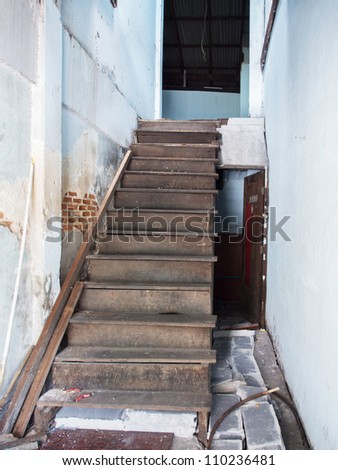 Old wooden stair in wrecked house need repair and redecoration