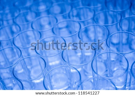 Blue water glasses arranged in orderly fashion for business meeting