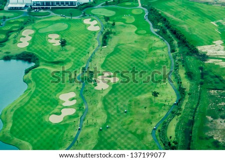 Bird eye view from private air craft, view of Bangkok crowded city the view of golf yard
