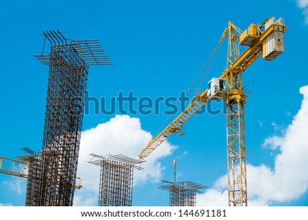 Crane at the construction site with metal pole foundation