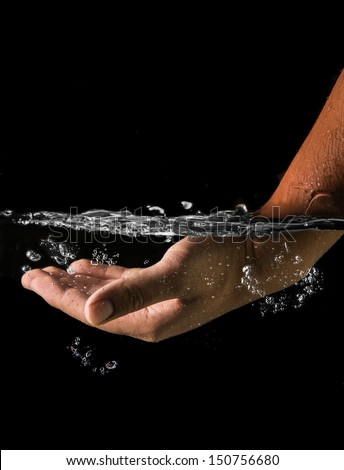 hand in water with black background. Concept of the hand that prevent you from drowning in term of business or life security