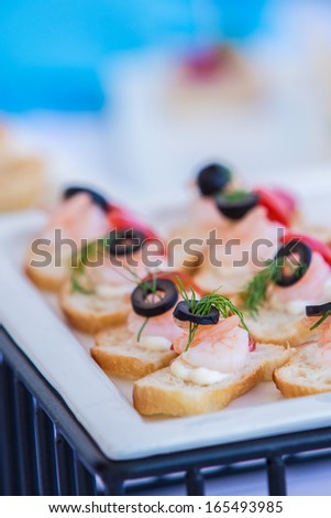 snack bar at cocktail party, shrimps on bread
