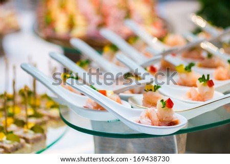 cocktail party decoration with shrimp in spoon