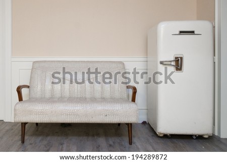 vintage furniture in the corner with sofa and old refrigerator