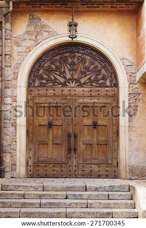 old vintage wooden door with italian style wall and stair