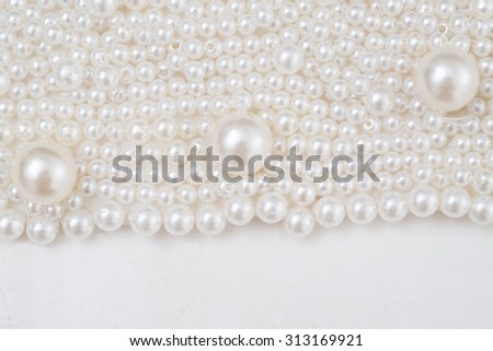 part of wedding dress with decoration of pearls and features