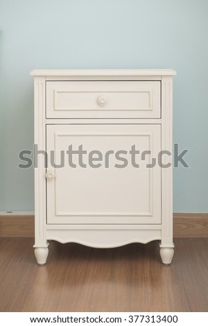 Vintage style short cabinet with drawer in the room