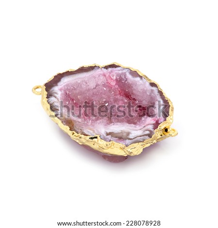 Beautiful natural pink mineral in gold frame. White background. Macro shooting.