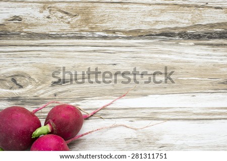 Radish on a wooden background. Rustic background.