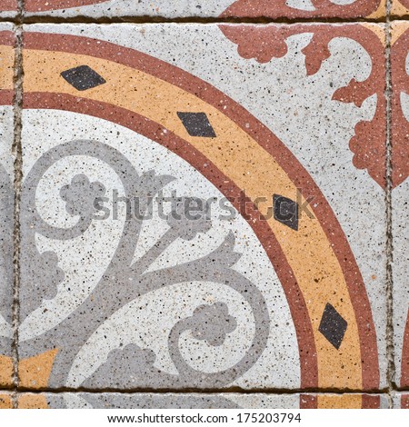 pattern on an ancient square paving tile