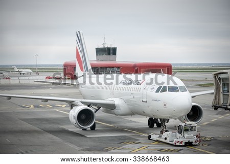 NICE,FRANCE - OCTOBER 27 2015 : french company air france airbus a320  pushed back from his airport gate by a special tractor.