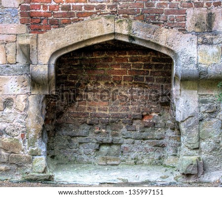 Ancient castle fireplace made of stone and brick