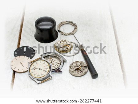 Old clock, parts and repair tools